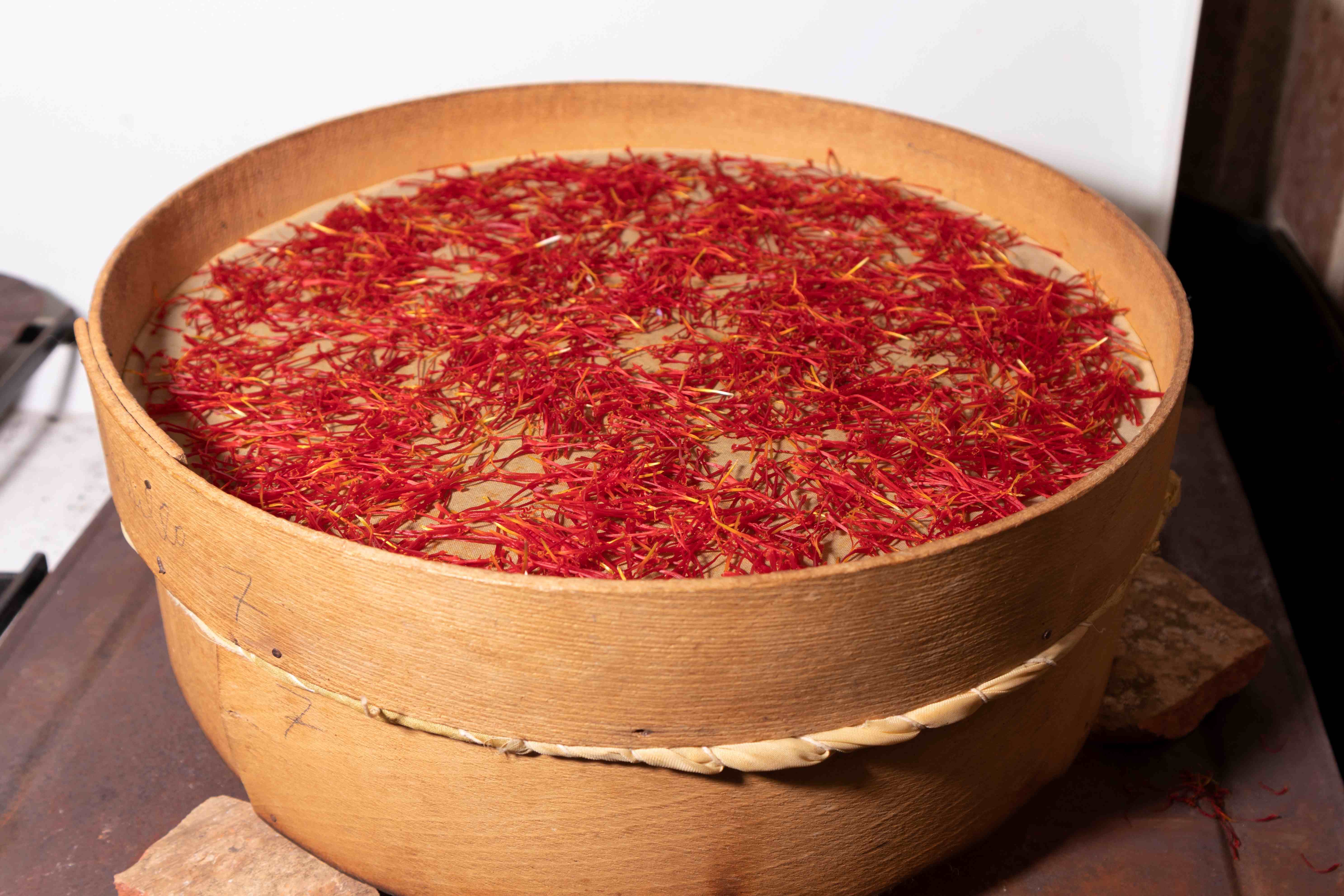Picture of saffron being dried on  a special instrument